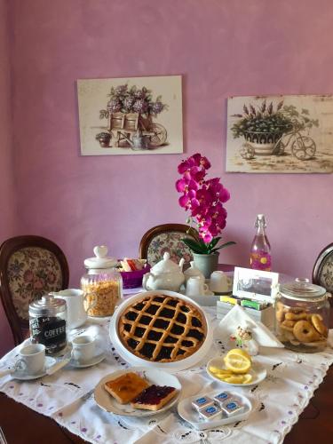 a table with a plate of breakfast food on it at Agriturismo MonteCrespini in Saturnia