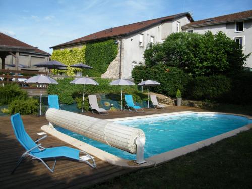 a swimming pool with at Les Charmois - Spa privatif en supplément et sur un autre site in Bains-les-Bains