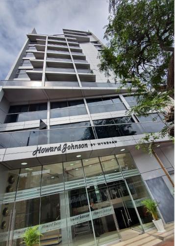 a building with a sign on the front of it at Howard Johnson by Wyndham Lima Miraflores Art House in Lima