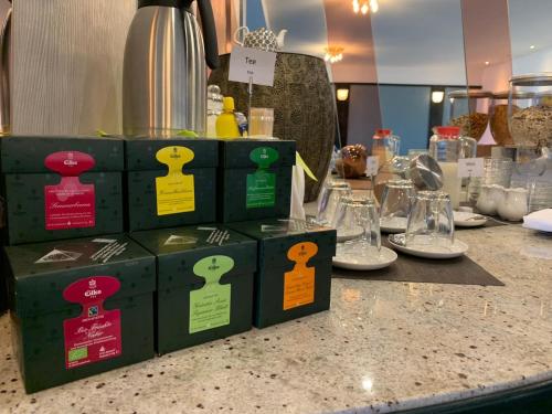 a counter with four boxes with keys on them at Hotel Hennesburg in Eisenach