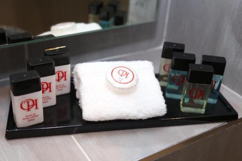 a tray with towels and other products on a counter at The Old Hall Hotel in Coventry
