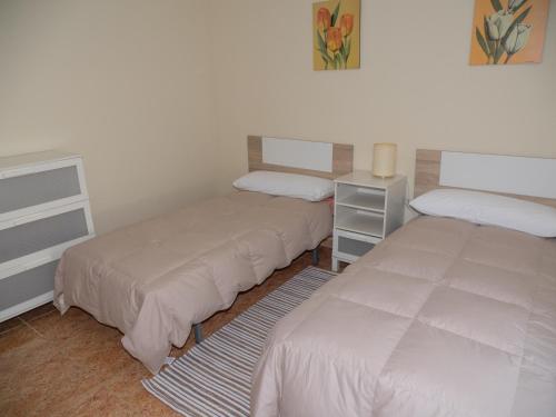 Katil atau katil-katil dalam bilik di Apartamento Sanchiz