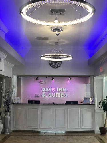 a room with a stage with a purple ceiling at Days Inn & Suites by Wyndham Lakeland in Lakeland