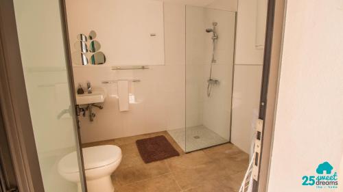 a bathroom with a shower and a toilet at Son Ramis in Llubí