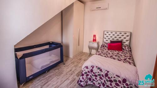 a bedroom with a bed with a red pillow on it at Son Ramis in Llubí