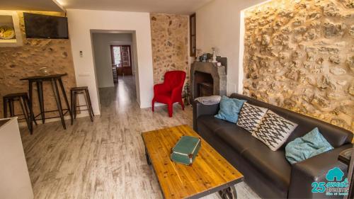 a living room with a couch and a table at Son Ramis in Llubí