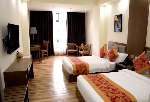 TV a/nebo společenská místnost v ubytování Hotel Tugos