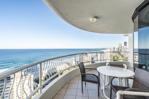 a view from a balcony of a beach with a view of the ocean at Biarritz Apartments in Gold Coast
