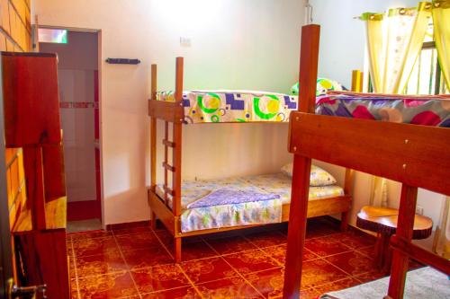 Cama o camas de una habitación en Hostal Luna Llena