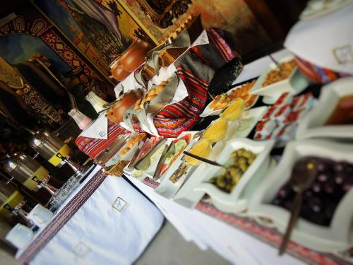 a buffet of food with red boots on display at Hotel San Francisco Plaza in Cusco