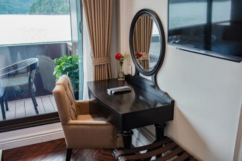 a mirror sitting on top of a desk next to a window at Stellar of the Seas Cruise in Ha Long