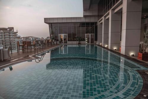 a swimming pool on the roof of a building at Platinum One Suites in Colombo