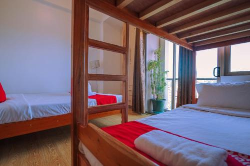 a bedroom with two bunk beds and a window at Cedar Peak Condo - Close to Session Road City Center in Baguio