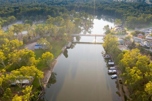 an aerial view of a river with a bridge at Statesman Motor Inn in Corowa