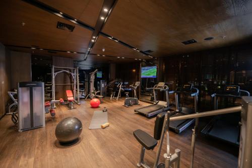 a gym with various exercise equipment in a room at Swiss-Belboutique Bneid Al Gar Kuwait in Kuwait