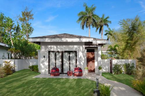 a rendering of a house with a yard at Kandaya Resort in Daanbantayan