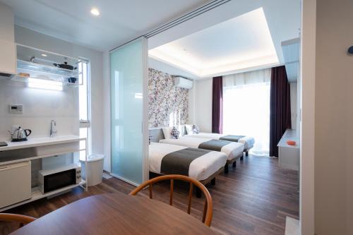 Postel nebo postele na pokoji v ubytování Hotel SAILS Asakusa