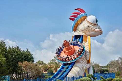 a large statue of a fish in a park at Shinhwa Jeju Shinhwa World Hotels in Seogwipo
