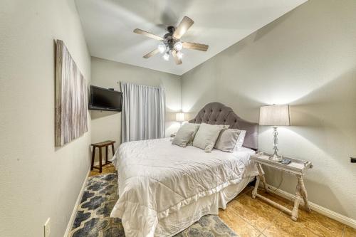 a bedroom with a bed and a ceiling fan at The Village at Gruene in New Braunfels