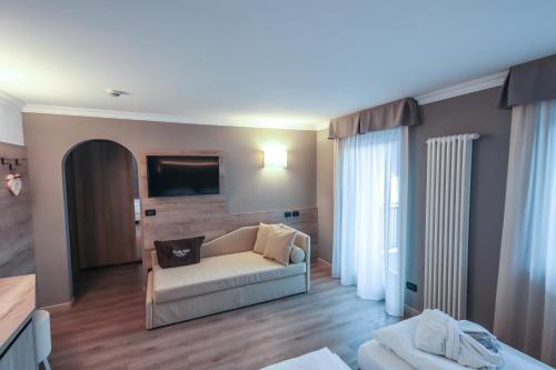 Letto o letti in una camera di Family Hotel Gran Baita