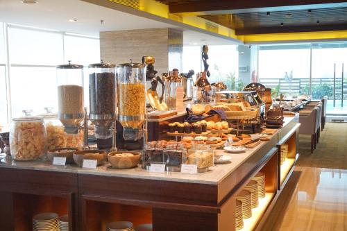 a buffet line with many different types of food at Swiss-Belhotel Serpong in Serpong