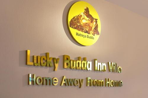 a sign for the harley davidson inn ville home away from home at Lucky Budda Inn Villa in Hanoi