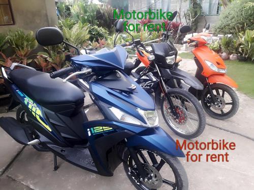 a group of motorcycles parked next to each other at LHOYJEAN Garden Hostel in Batuan