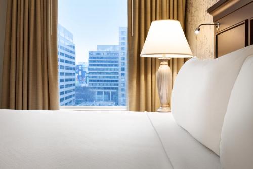 a hotel room with a bed and a window at Crowne Plaza Crystal City-Washington, D.C. by IHG in Arlington
