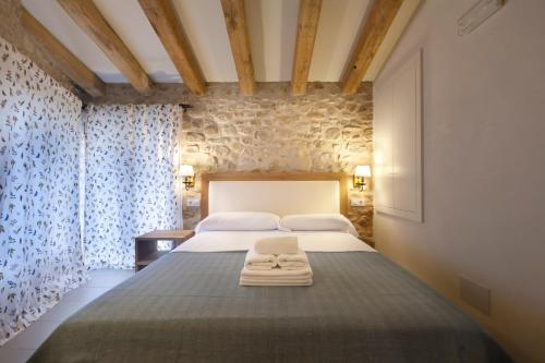 Can Clotas Hotel Masiaにあるベッド