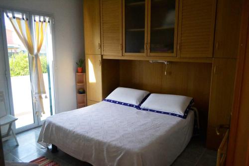 Ένα ή περισσότερα κρεβάτια σε δωμάτιο στο Casa de campo al mare