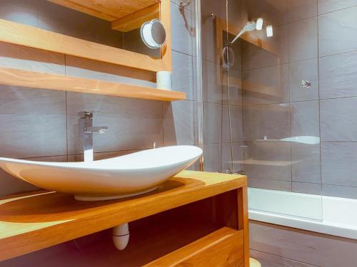 a bathroom with a sink and a shower at Boost Your Immo Les Deux Alpes 185 in Les Deux Alpes