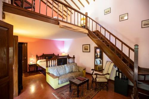 a living room with a staircase leading to a bedroom at Presa di Goa - Managed by Smith and Appy in Calangute