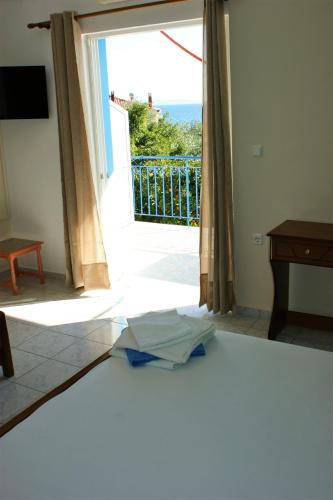 a broken umbrella on the floor in front of a door at Elena's Family Apartments in Leonidion