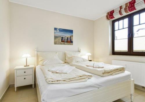 Postel nebo postele na pokoji v ubytování Urlaubsträume am Meer