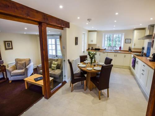 a kitchen and dining room with a table and chairs at Anne Boleyn in Winchcombe