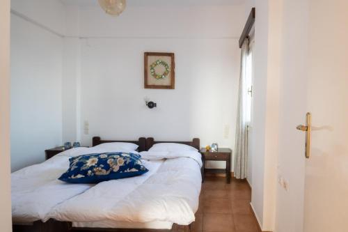 a bedroom with a bed with a pillow on it at Margarita Apartments in Ierápetra