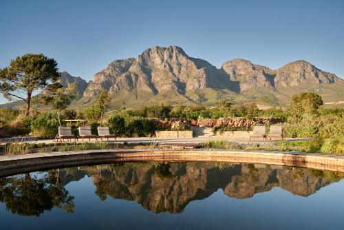 
a river with mountains and a mountain range at Boschendal Farm Estate in Franschhoek
