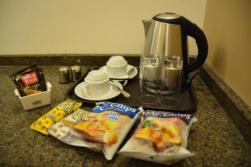 a counter with bags of food and a blender at سما عمان للشقق الفندقية Sama Amman Hotel Apartments in Amman