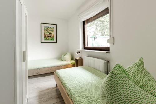 Ένα ή περισσότερα κρεβάτια σε δωμάτιο στο Haus Amelie