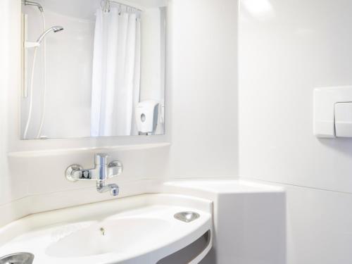 Koupelna v ubytování Première Classe Lille Sud Henin Beaumont