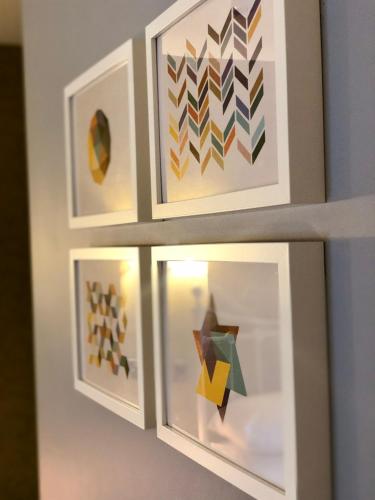 a set of three framed artworks on a wall at Hardwick Arms Hotel in Sedgefield