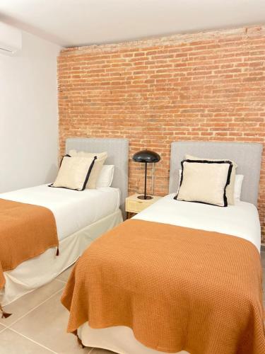 Llit o llits en una habitació de Apartamentos con encanto en La Latina