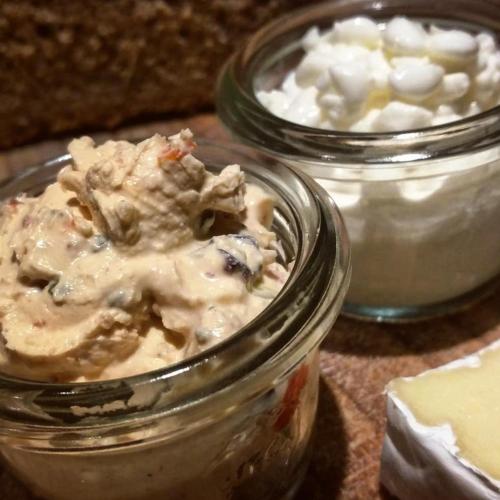 three glass jars of food with dip and cheese at Galerie Hotel in Paderborn