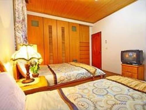 Cama o camas de una habitación en Yilan Affectivity