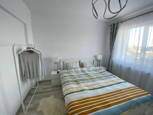 Ένα ή περισσότερα κρεβάτια σε δωμάτιο στο Libertatii 88 Luxury Apartment