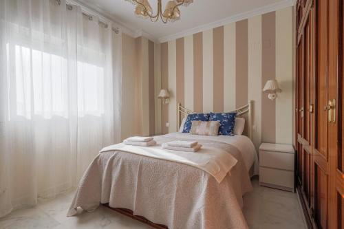 Cama o camas de una habitación en Descanso-elegancia en Sevilla Parking Gratuito