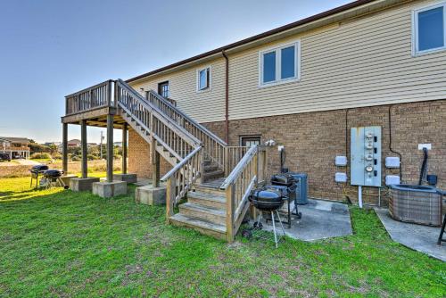 a staircase leading up to a house with a grill at Hannahs Place - Quaint and Cozy Apt by the Beach! in Emerald Isle