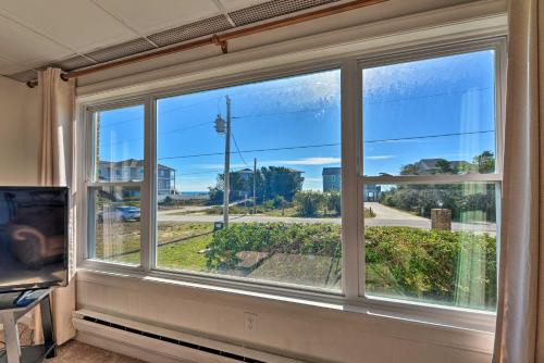 a room with a window with a view of a street at Hannahs Place - Quaint and Cozy Apt by the Beach! in Emerald Isle
