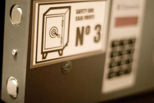 a close up of a microwave door with a sticker on it at Hotel Ciutat De Sant Adria in Sant Adria de Besos