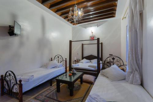 Postel nebo postele na pokoji v ubytování Riad Oussari